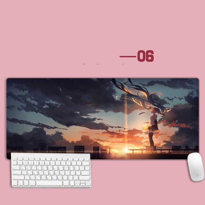 Large mouse pad with an anime-style design of a person standing on a bridge at sunset, placed on a pink surface with a keyboard and mouse in front.
