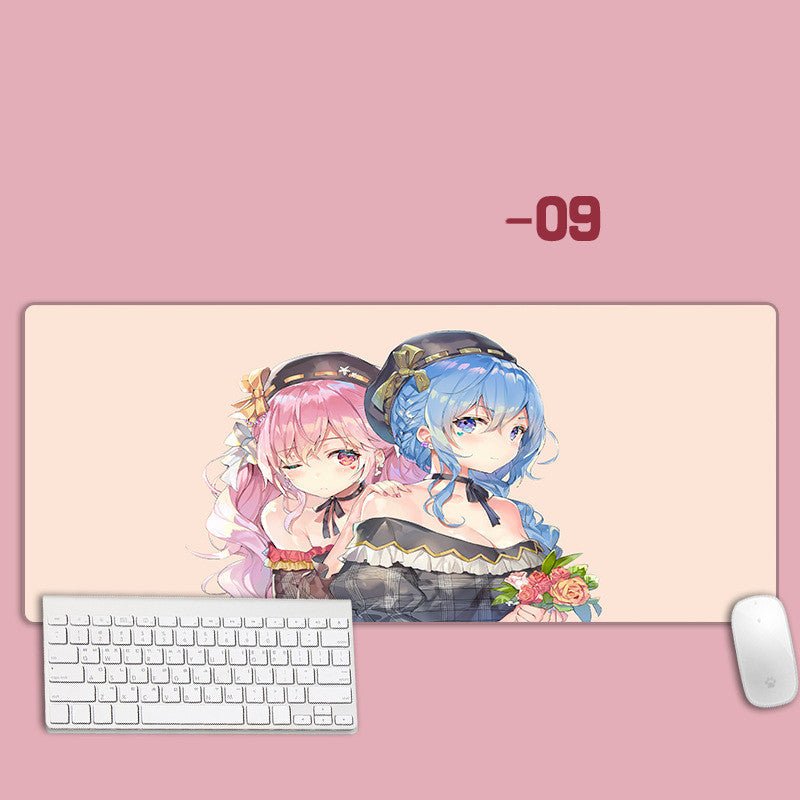 Large mouse pad with anime characters on a pink background