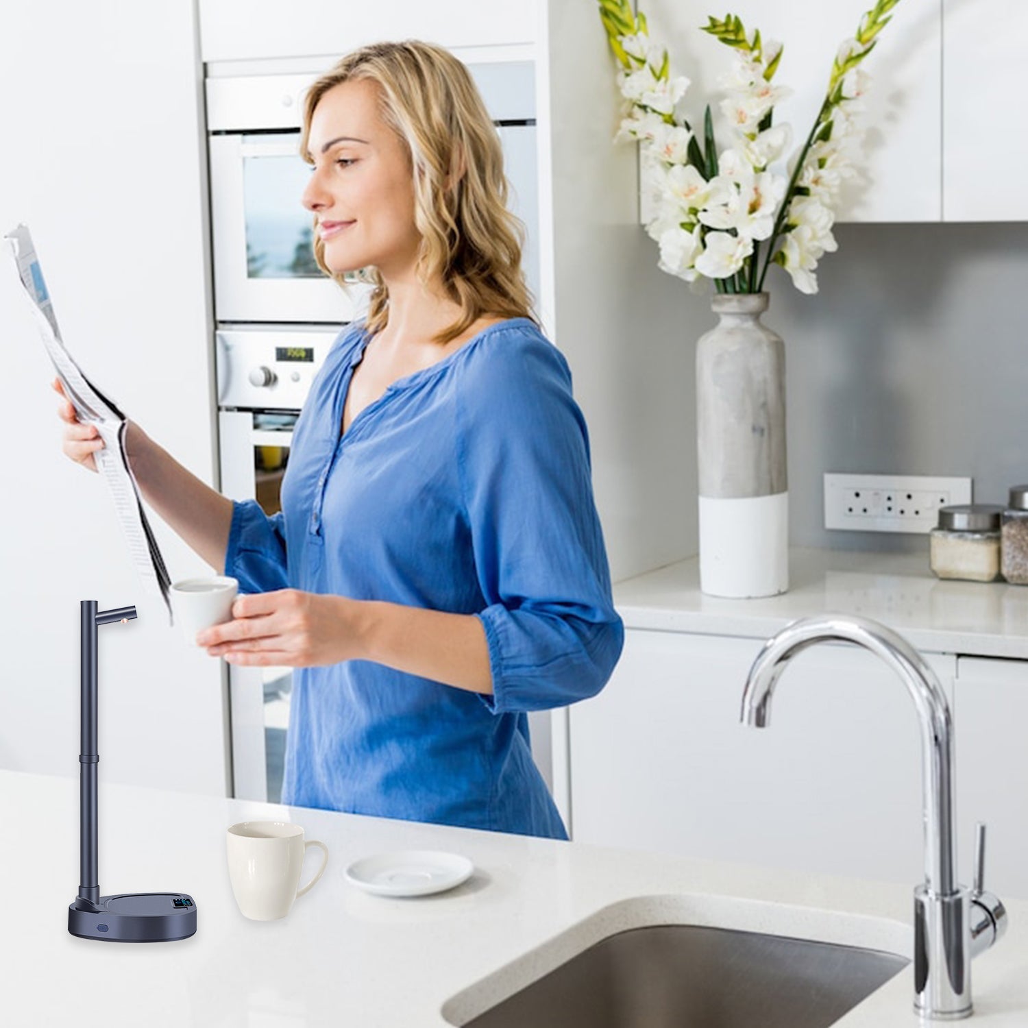 Woman in a kitchen holding a newspaper, with a modern kitchen setup including a sink and countertop.