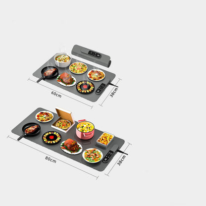 Portable electric cooktop with food items on a white background
