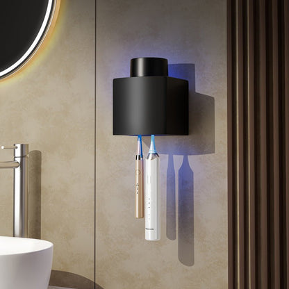 Black wall-mounted toothbrush holder with toothbrushes in a bathroom setting.