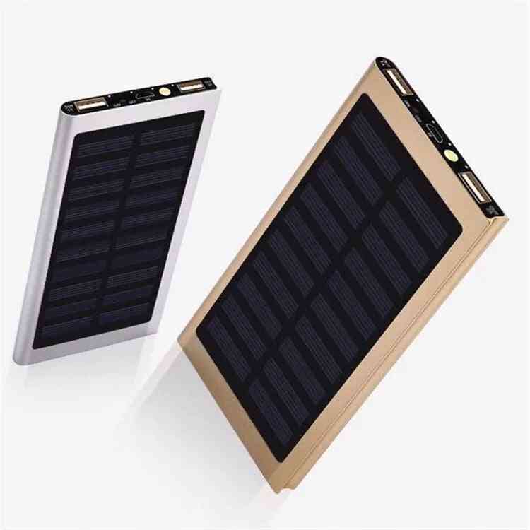 Two solar power banks, one gold and one silver, on a white background.