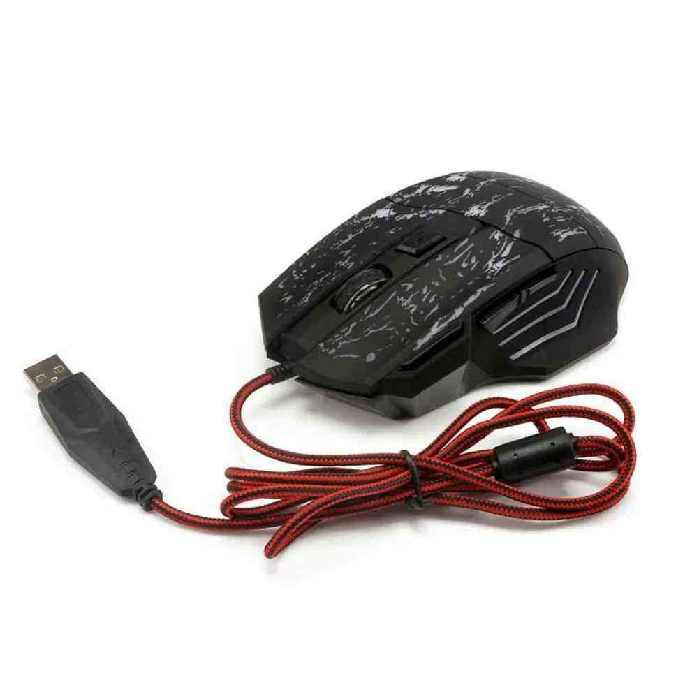 Gaming mouse with USB cable on a white background