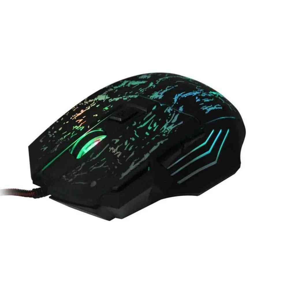 Gaming mouse with green and blue lighting on a white background