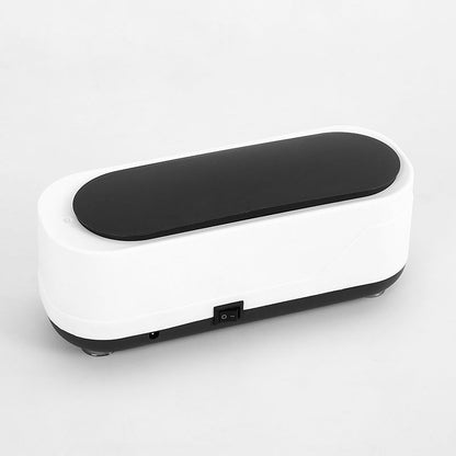 White and black vibration plate on a light gray background