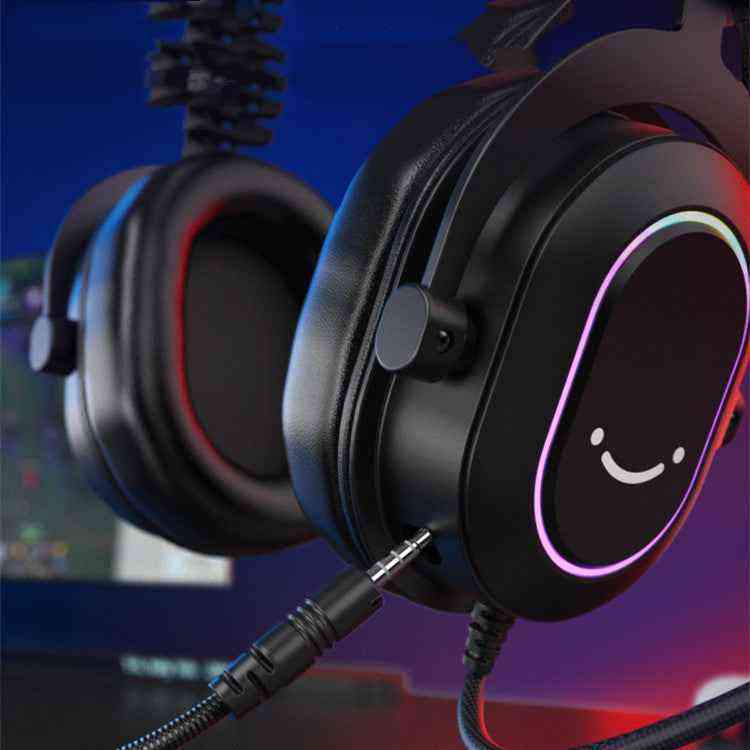 USB Gaming Headset with smiley face design on ear cup, connected to a computer monitor.