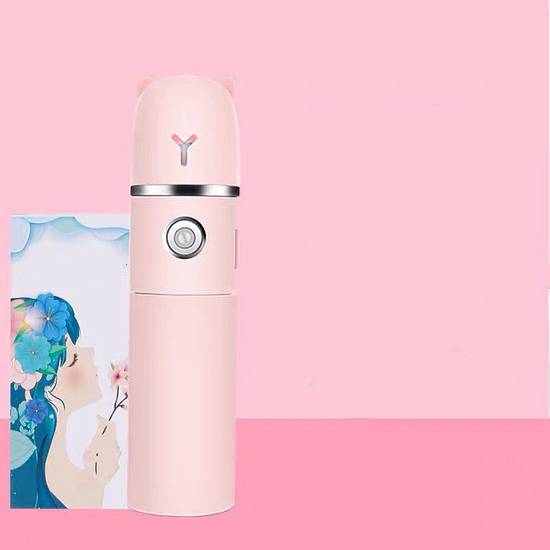 Pink travel mug with a brand logo on a pink background