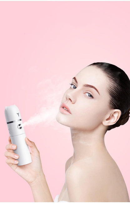 Woman holding a white device with a pink background