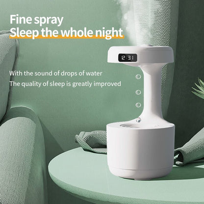 White humidifier on a green table with text about its benefits