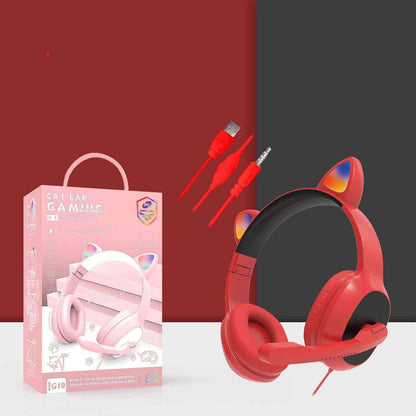 Red gaming headset with cat ear design, packaging, and accessories on a white surface.