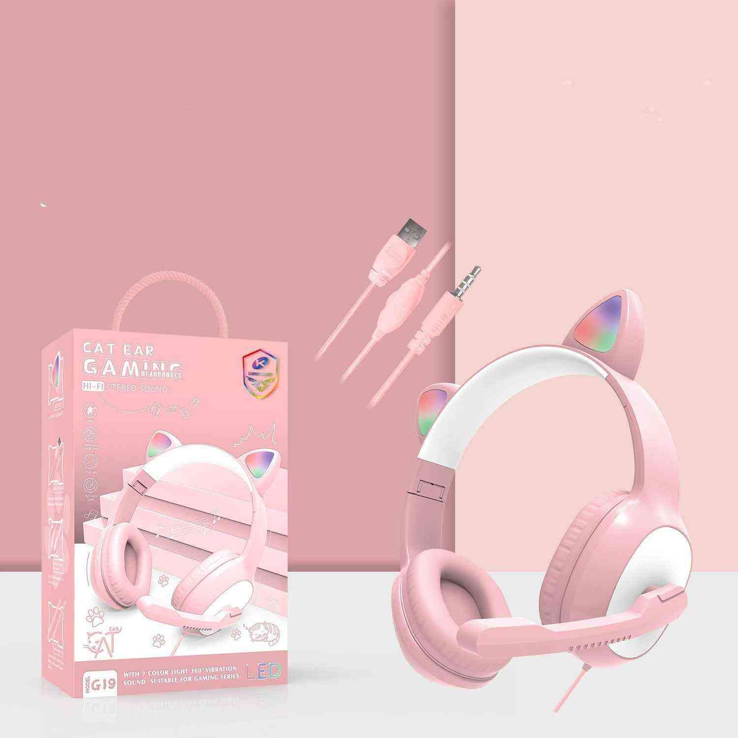 Pink cat ear gaming headset with packaging, cable, and microphone on a pink background