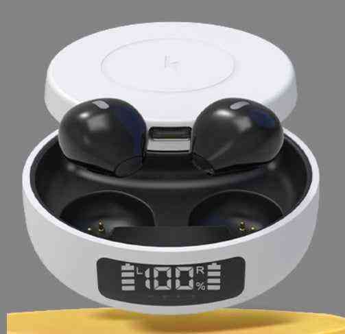 Black wireless earbuds in a white charging case with a digital display on a gray background.