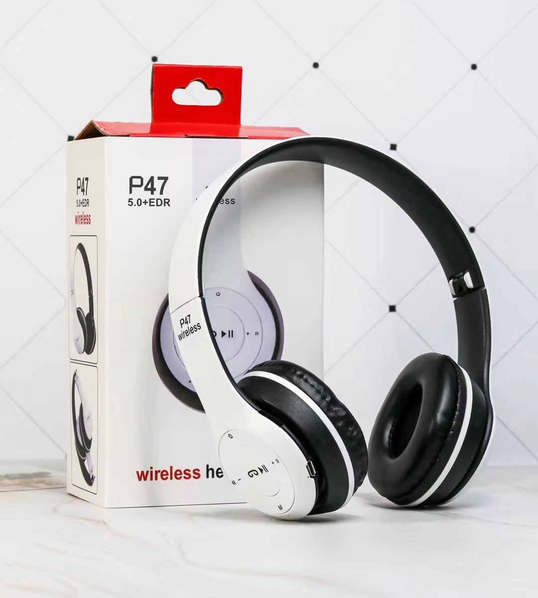 White wireless headphones with black ear cups on a white box labeled 'P47' against a light gray background.