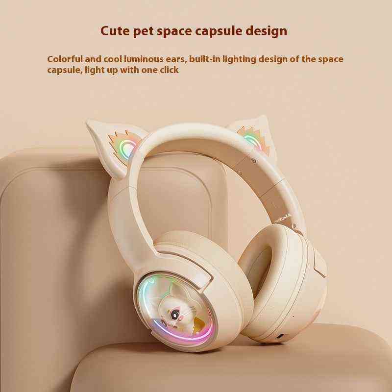 Headphones with space capsule design and colorful lighting on a beige background