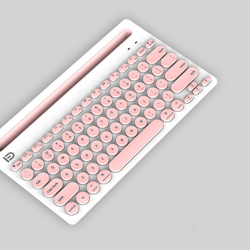 Pink and white wireless bluetooth keyboard on a gray background