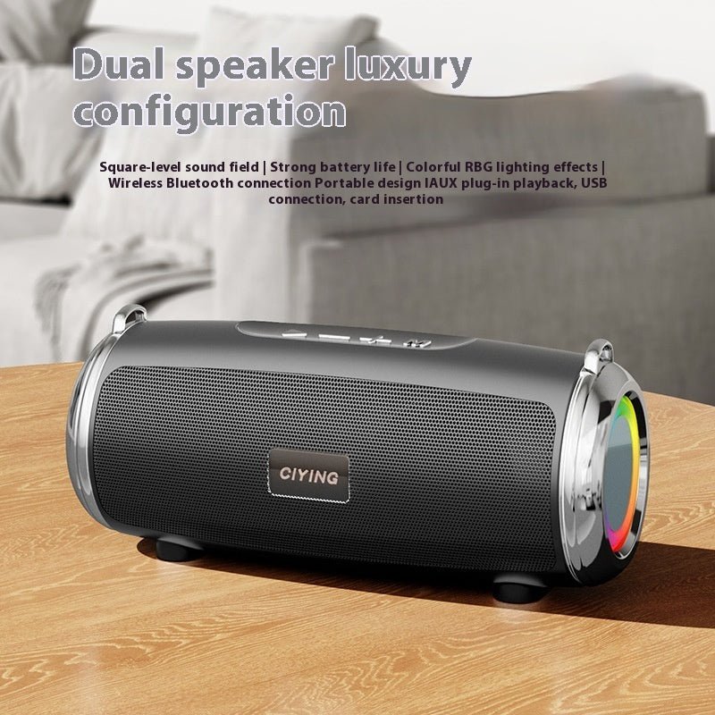 Black portable speaker with colorful lighting effects on a wooden surface, text describing features.