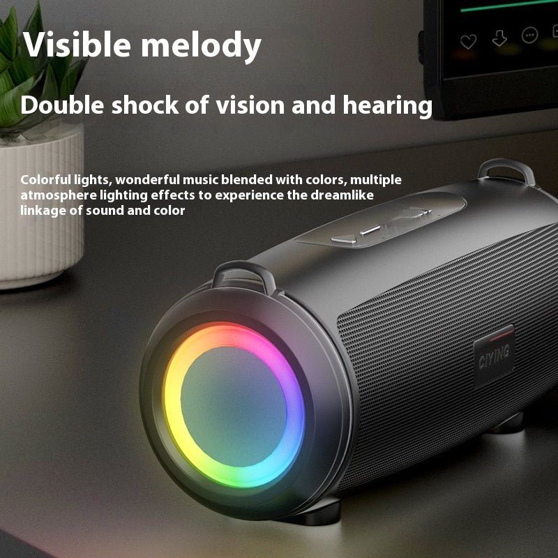 Black portable speaker with colorful lights on a dark surface, text about sound and vision experience.