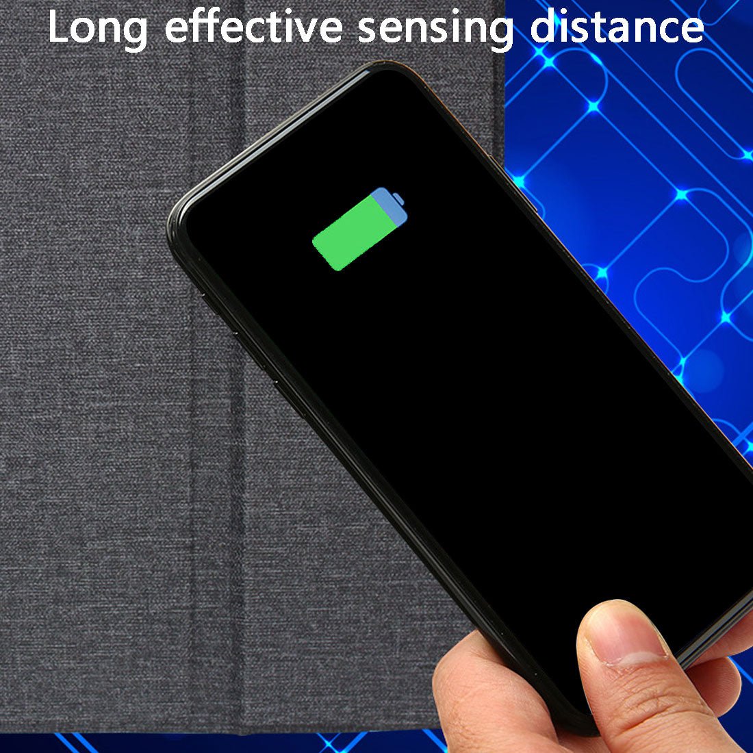 Hand holding a smartphone with a battery icon on the screen against a blue and gray background.