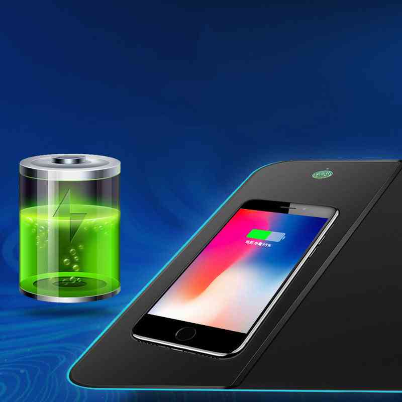 Phone with a charging pad and a glass container with green liquid on a blue background