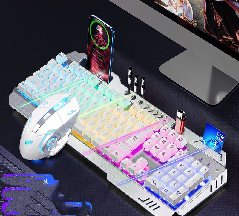Gaming setup with keyboard, mouse, and phone on a desk