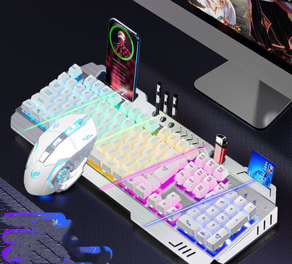 Gaming setup with keyboard, mouse, and phone on a desk