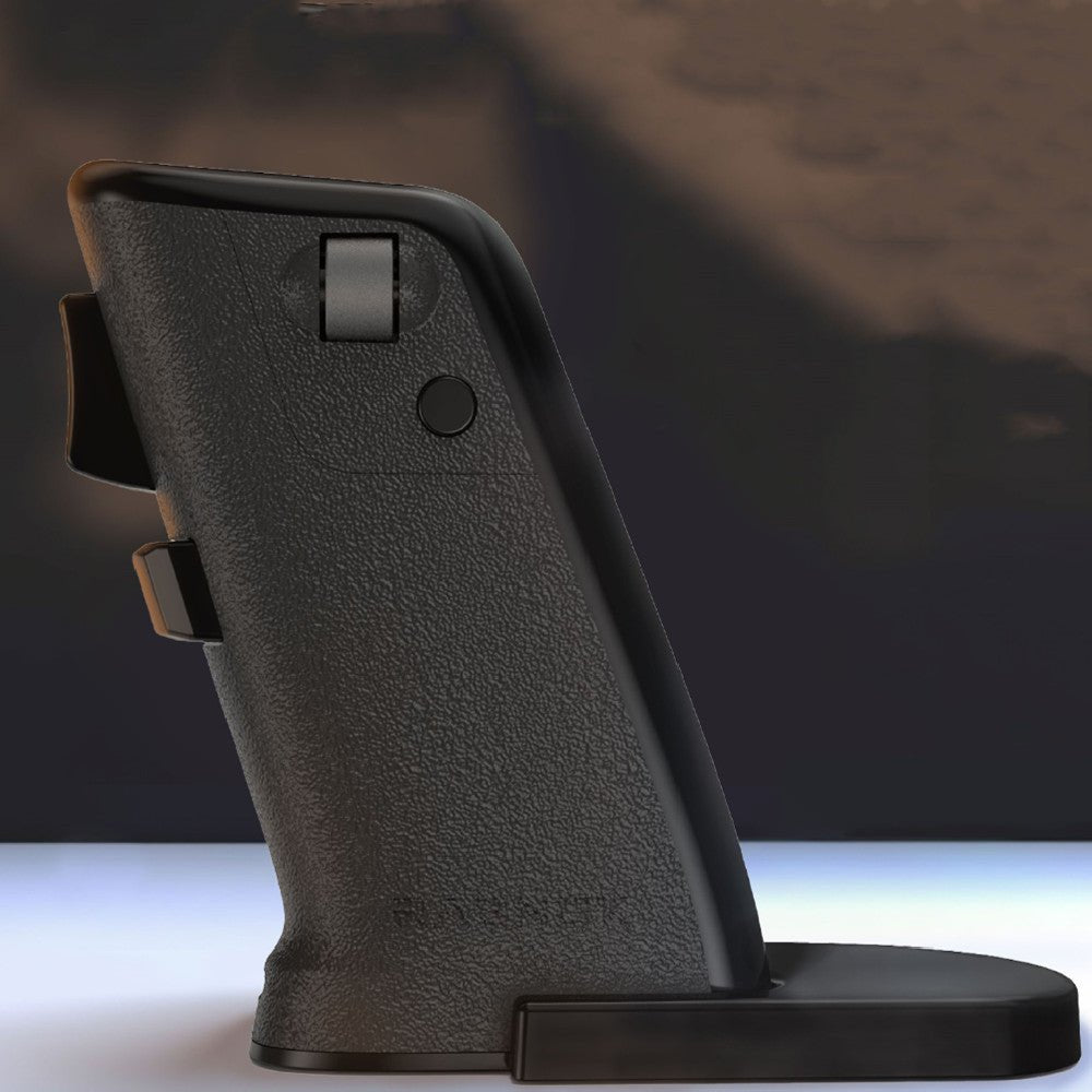 Black gun grip on a reflective surface with a dark background
