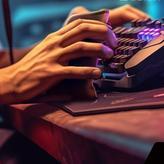 Close-up of hands typing on a colorful keyboard with a blurred background