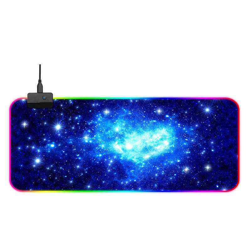Large mouse pad with galaxy design and RGB lighting on a white background