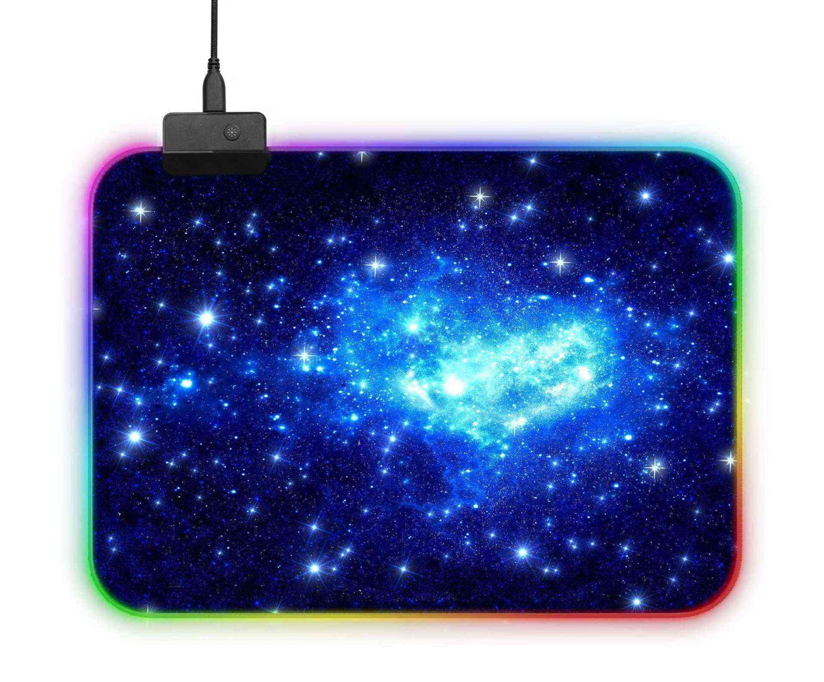 Mouse pad with galaxy design and USB cable on a white background