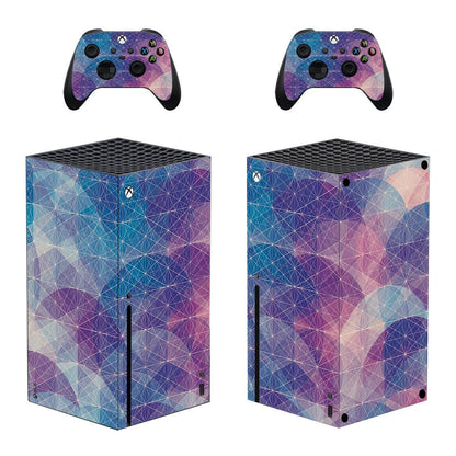 Gaming console and controllers with a geometric pattern on a white background