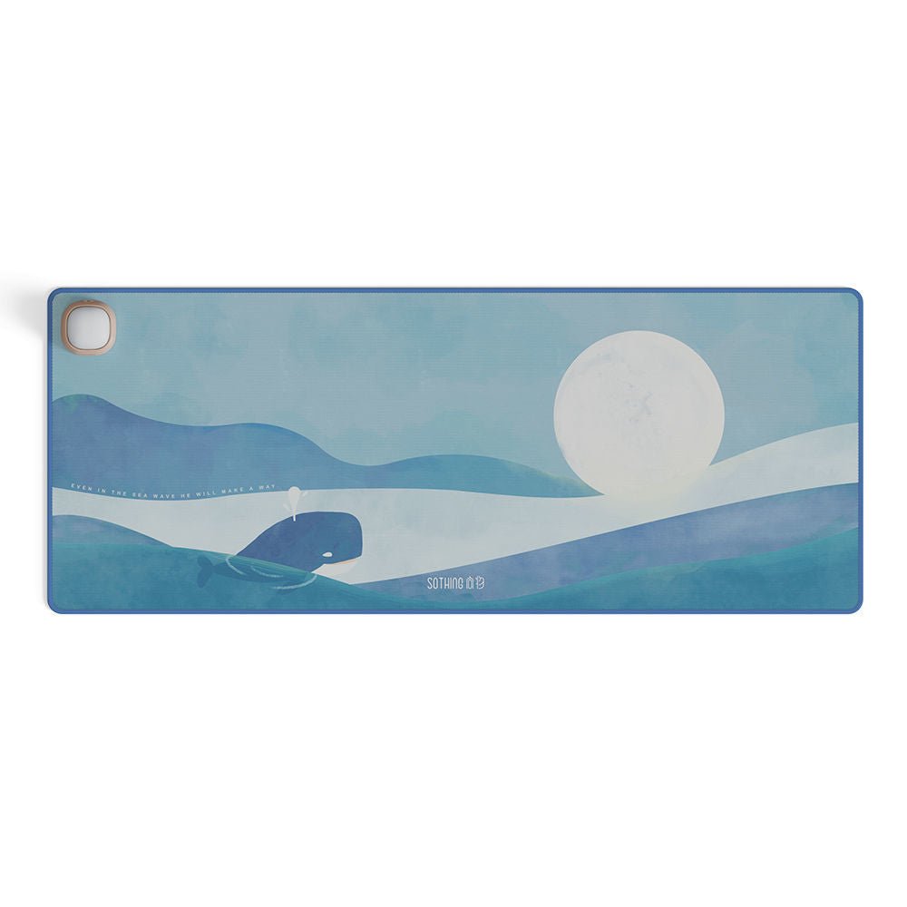 Yoga mat with whale and sunset design on a white background